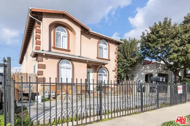 a kitchen with stainless steel appliances granite countertop a refrigerator a sink a stove a microwave and island