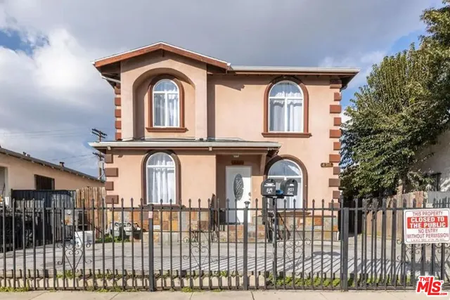 a kitchen with stainless steel appliances granite countertop a refrigerator a sink a stove a microwave and island