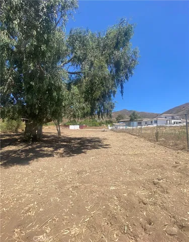 a view of a road with a building in the background