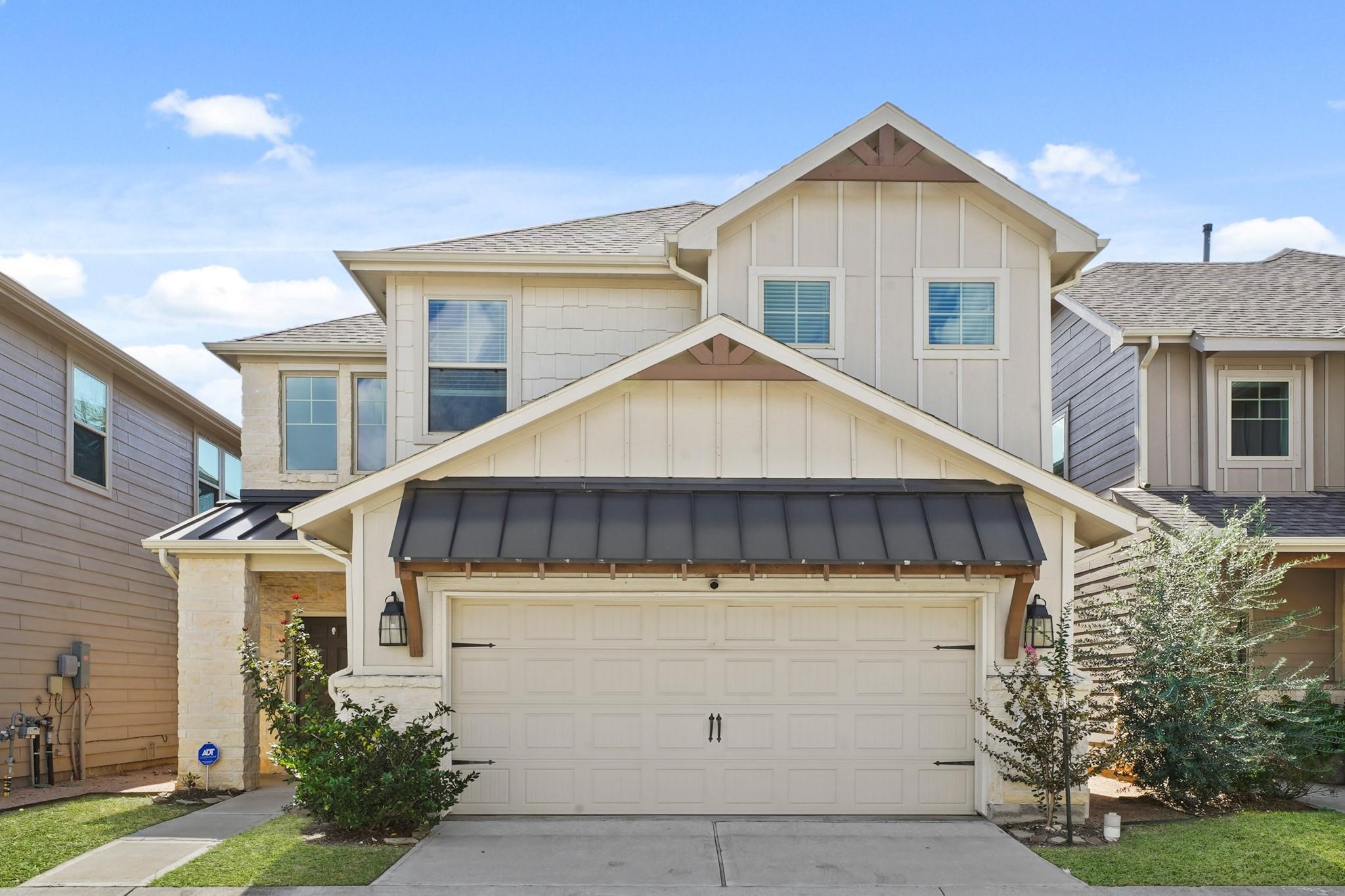 a view of a house with wooden fence