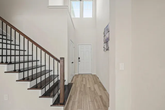 a view of entryway with wooden floor