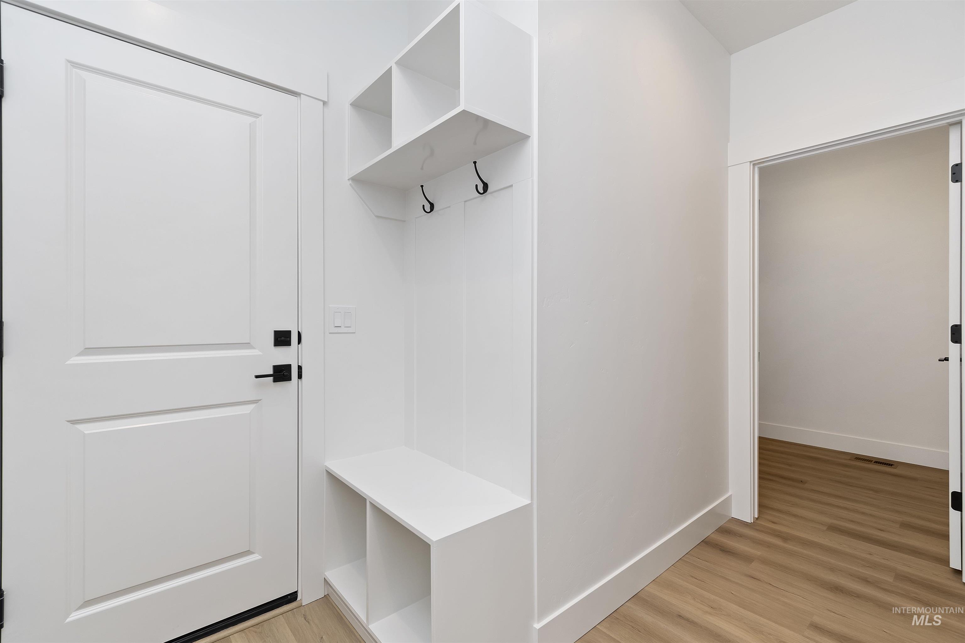 732 South Calhoun Lane Star, ID 83669 - Photo 19 of 50 Mudroom featuring light wood-style floors and baseboards