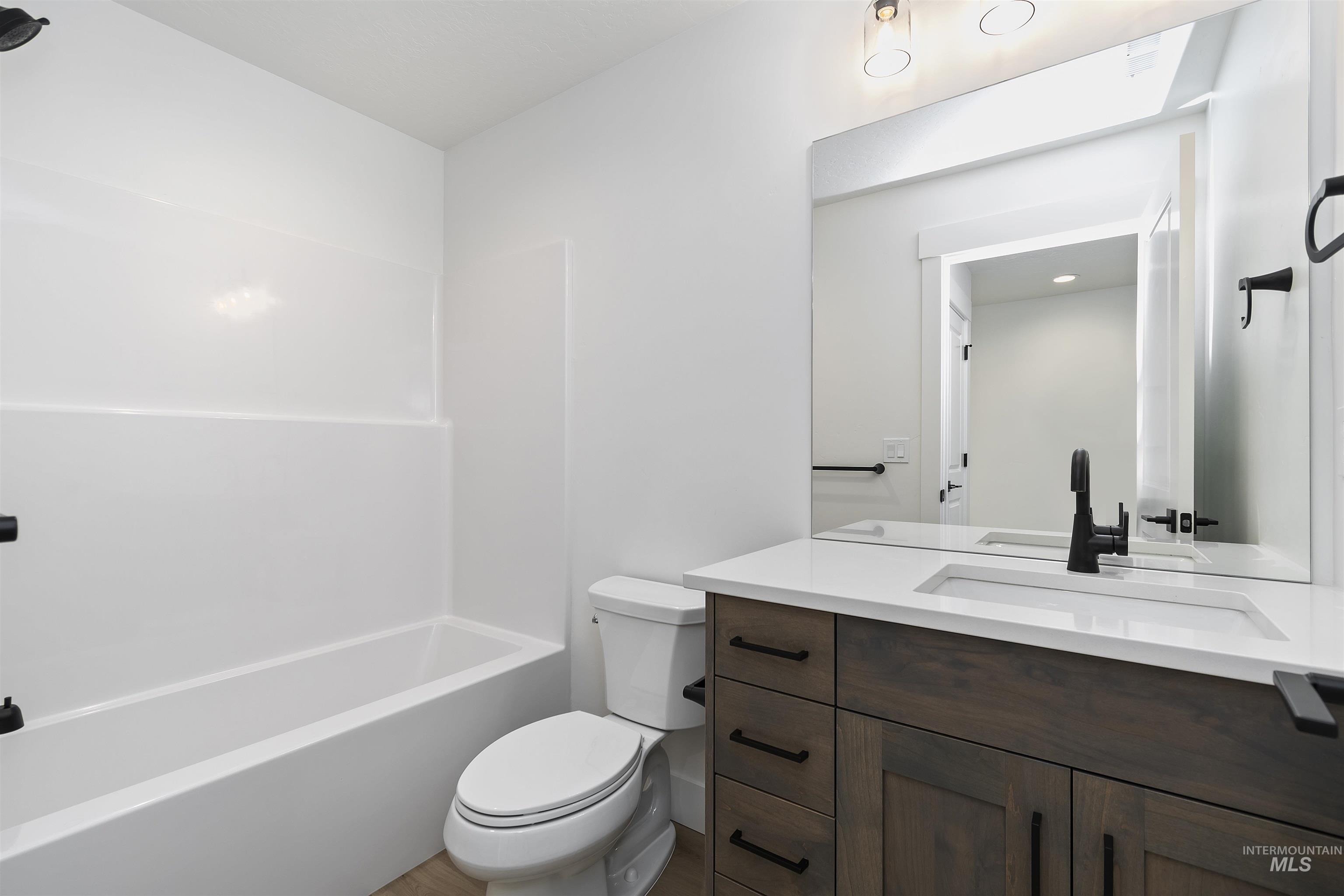 732 South Calhoun Lane Star, ID 83669 - Photo 31 of 50 Bathroom with vanity and tub / shower combination
