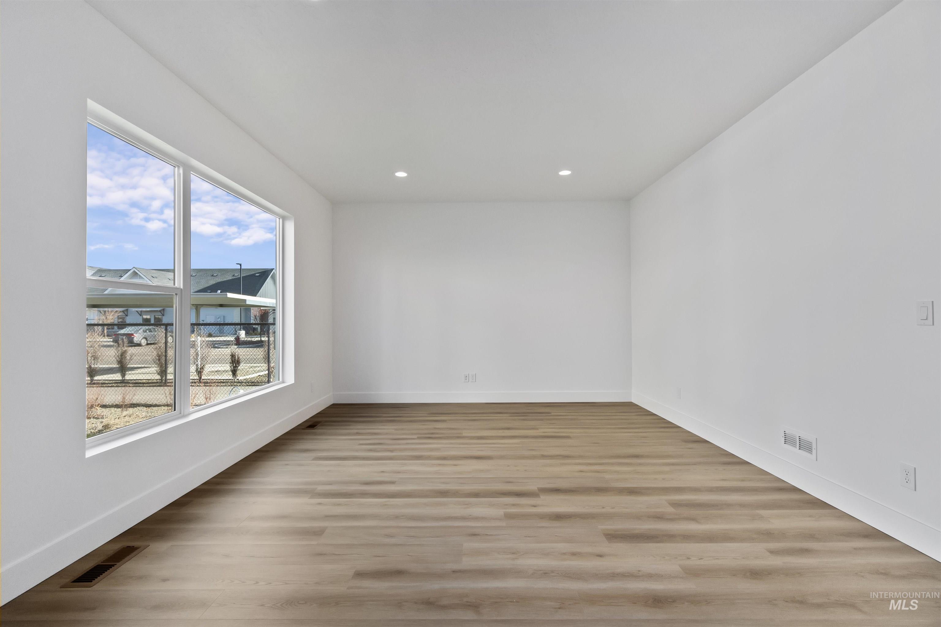732 South Calhoun Lane Star, ID 83669 - Photo 4 of 48 Unfurnished room with light wood-style flooring and recessed lighting