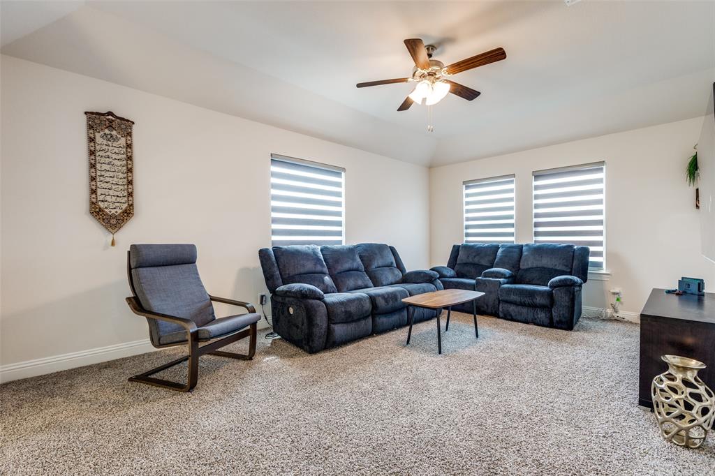 7636 Cherry Blossom Lane Little Elm, TX 76227 - Photo 12 of 31 a living room with furniture and a window