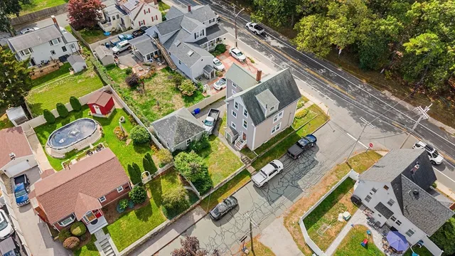 an aerial view of a house with a swimming pool