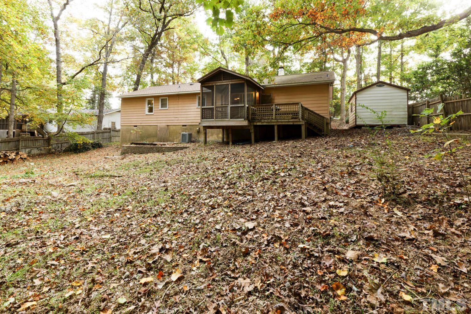7305 Louisburg Road Raleigh, NC 27616 - Photo 21 of 24 Tons of space back here! Surrounded by trees but open in the middle! Lots of Potential!