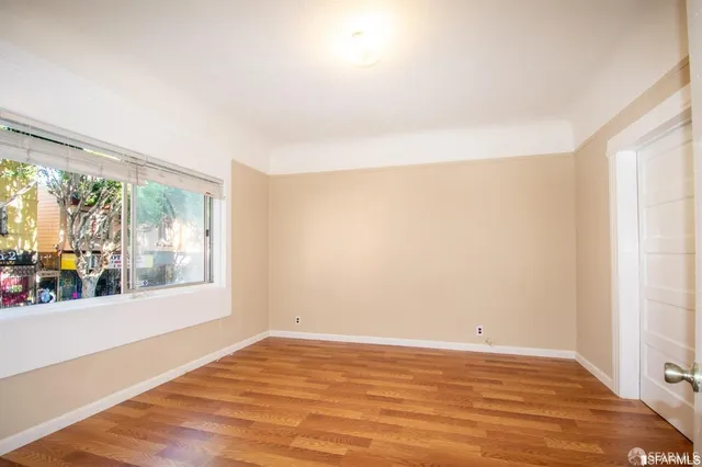 a view of an empty room with a window