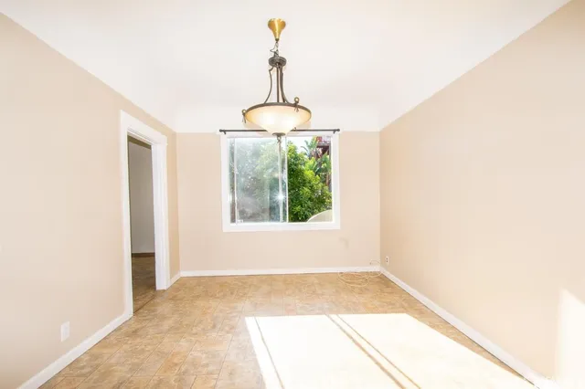 a bathroom with a window and a sink