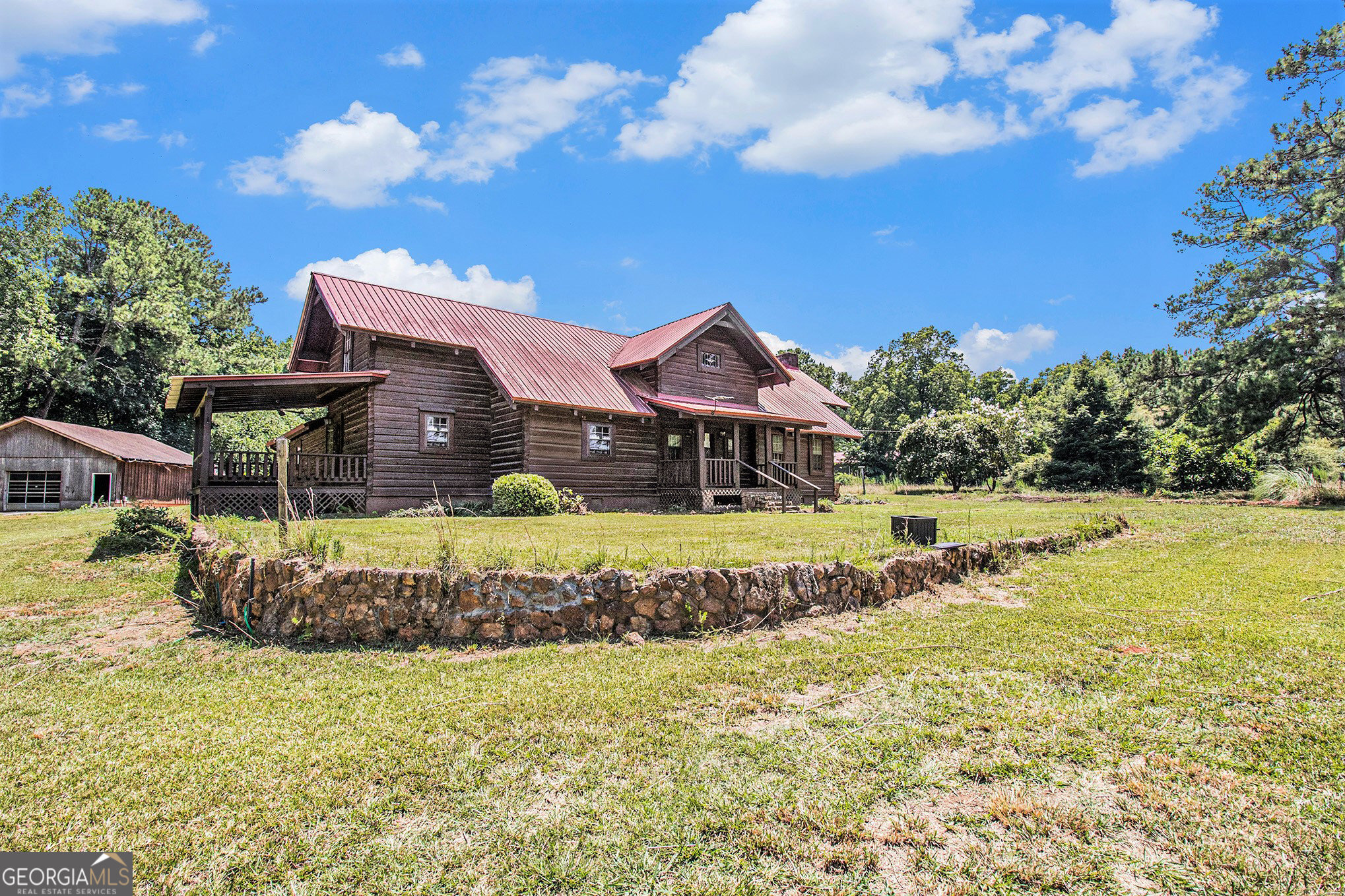 397 Highway 3 Street North Hampton, GA 30228 - Photo 23 of 32 a view of a house with a big yard and large trees