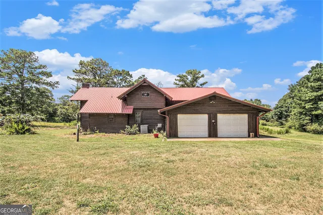 a view of a swimming pool with a house in the background
