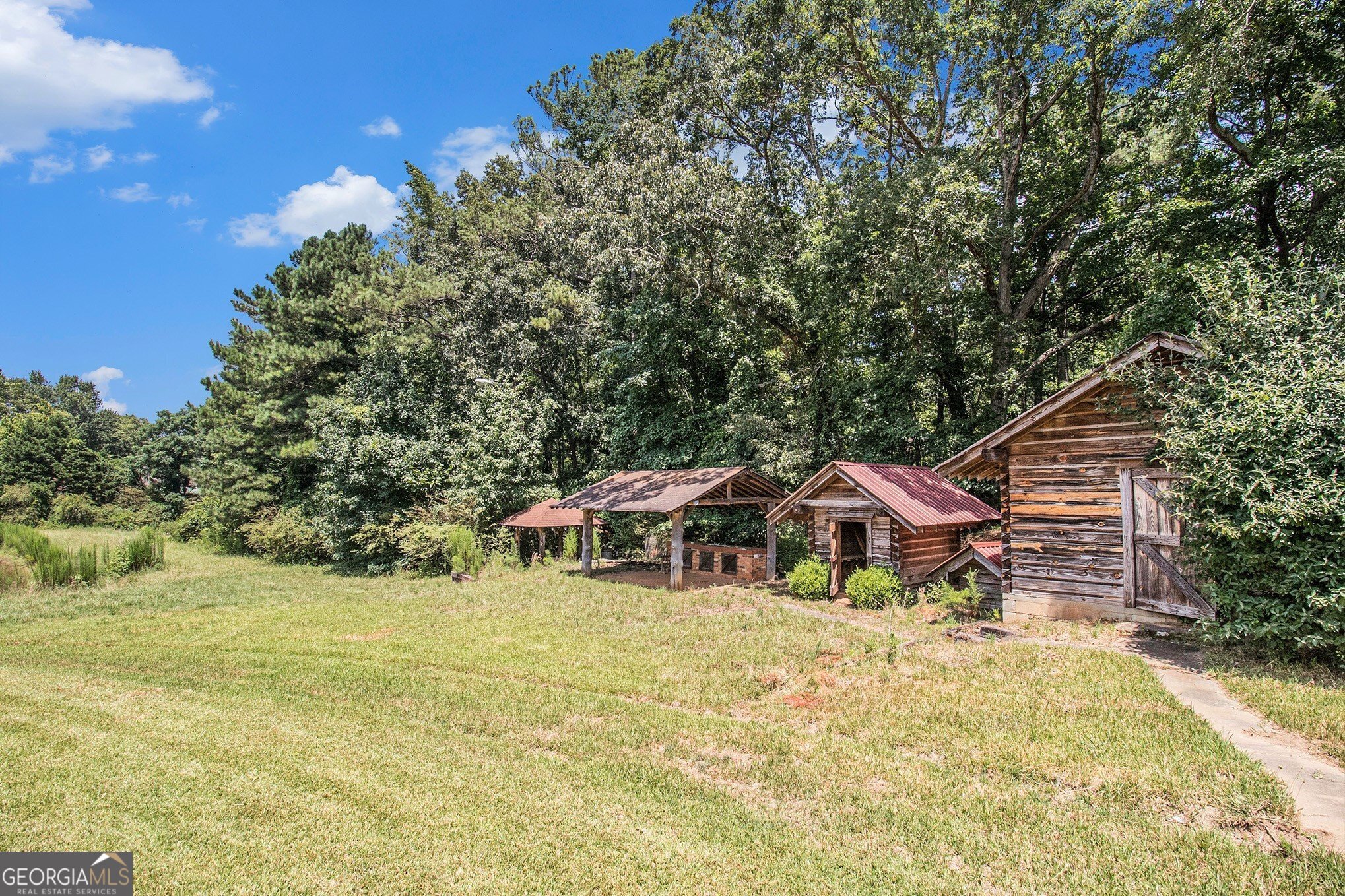 397 Highway 3 Street North Hampton, GA 30228 - Photo 31 of 32 a view of a house with yard and sitting area