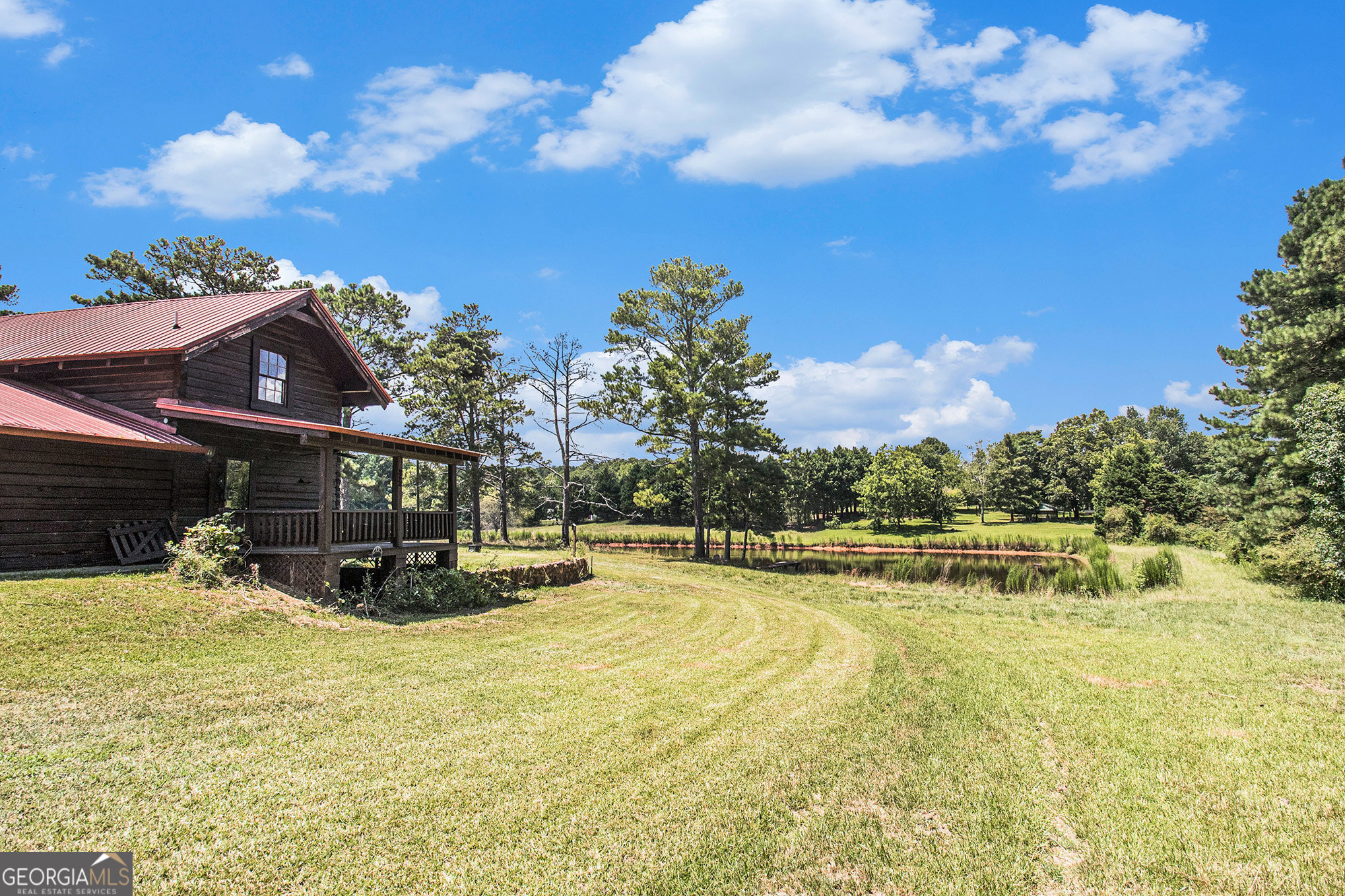 397 Highway 3 Street North Hampton, GA 30228 - Photo 32 of 32 a view of a swimming pool with a house in the background