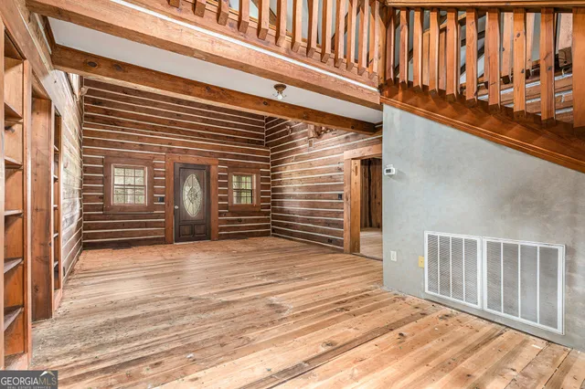 a view of a house with wooden stairs