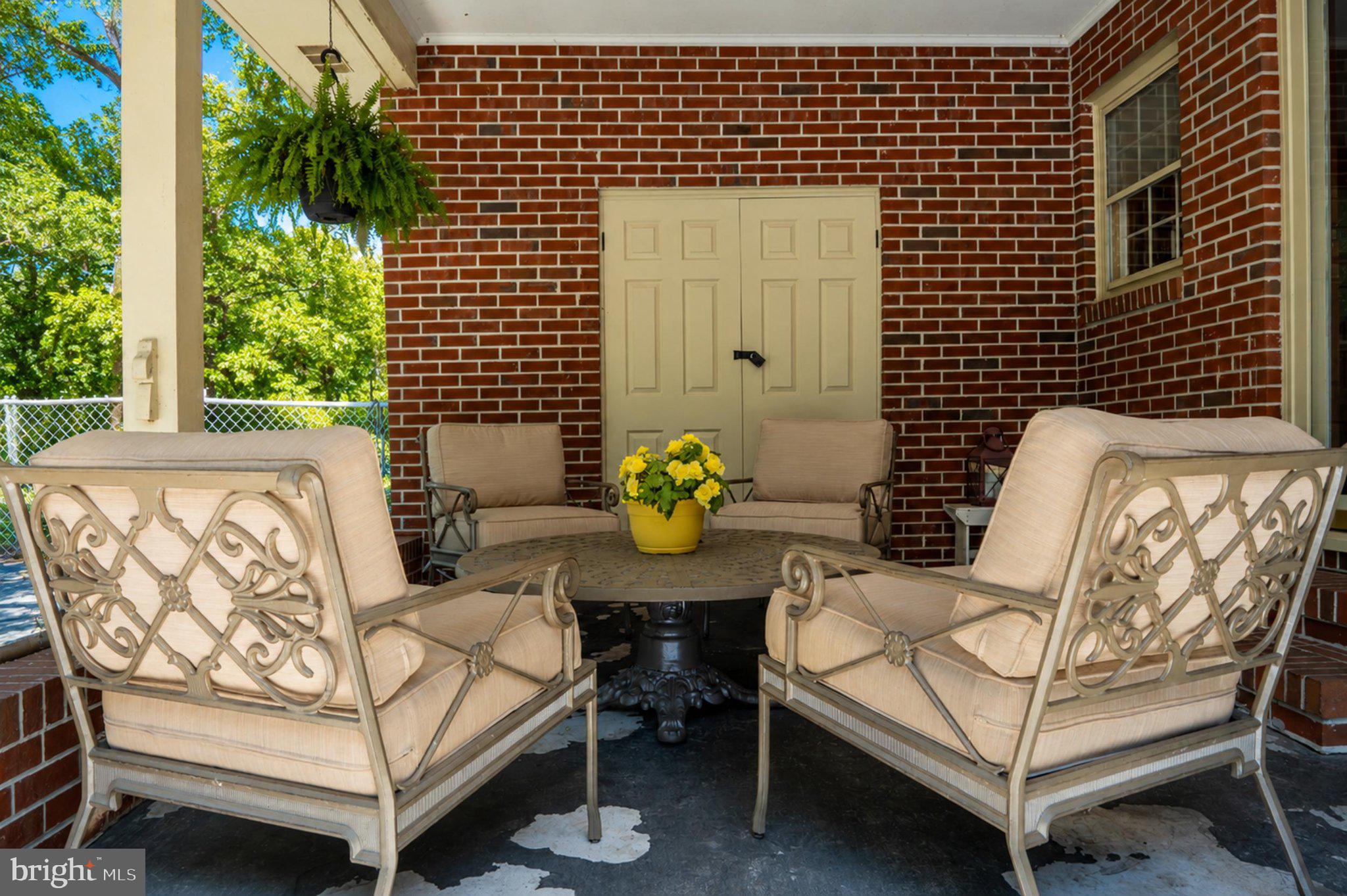 610 Beach Road White Stone, VA 22578 - Photo 3 of 23 Charming porch with inviting seating.