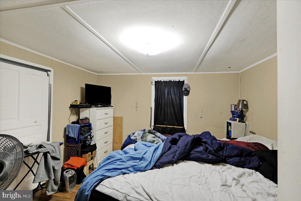 434 Main Street Oley, PA 19547 - Photo 30 of 30 a bedroom with a bed and flat screen tv