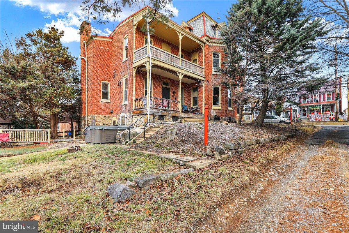 434 Main Street Oley, PA 19547 - Photo 3 of 30 a front view of a building with a yard