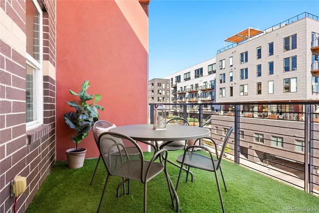 a view of a chairs and table in patio
