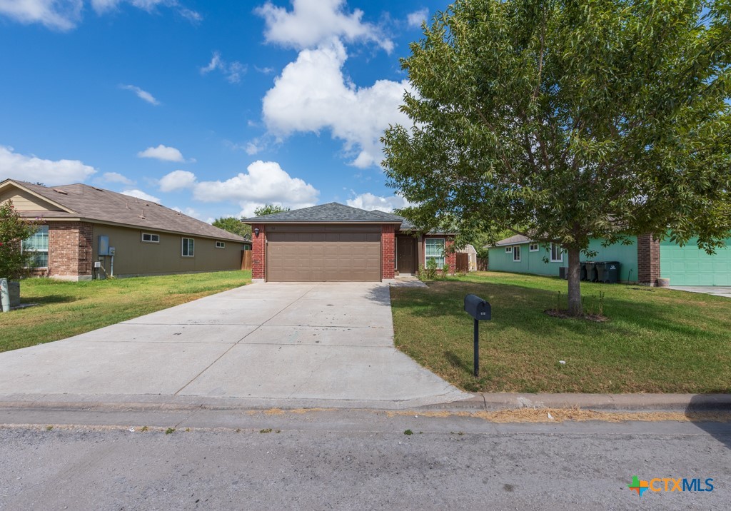 132 Talon Drive Luling, TX 78648 - Photo 1 of 1 a front view of a house with a yard and garage