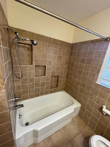 a bathroom with a bath tub