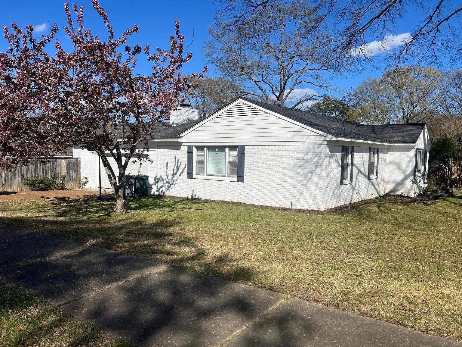 5568 Rich Road Memphis, TN 38120 - Photo 3 of 19 a front view of a house with garden