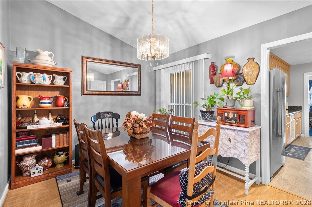 1912 Havilah Road Fayetteville, NC 28303 - Photo 3 of 14 a view of a dining room with furniture kitchen and wooden floor