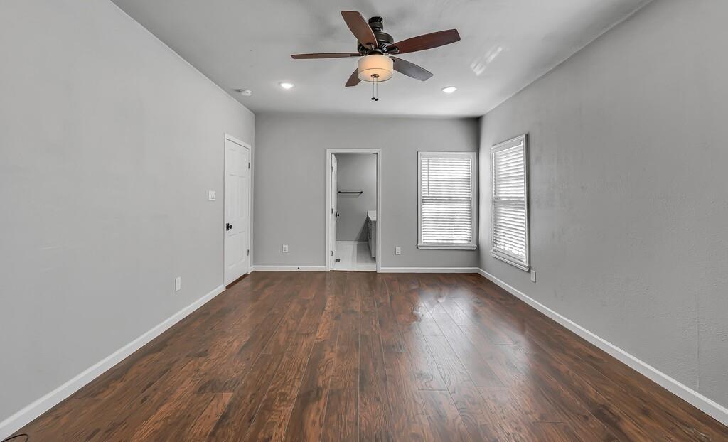 2001 Colcord Avenue Waco, TX 76707 - Photo 16 of 26 wooden floor in an empty room with a window