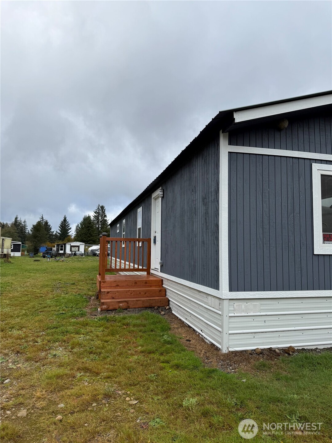2610 Calawah Way, Unit 47 Forks, WA 98331 - Photo 1 of 17 a house view with a garden space