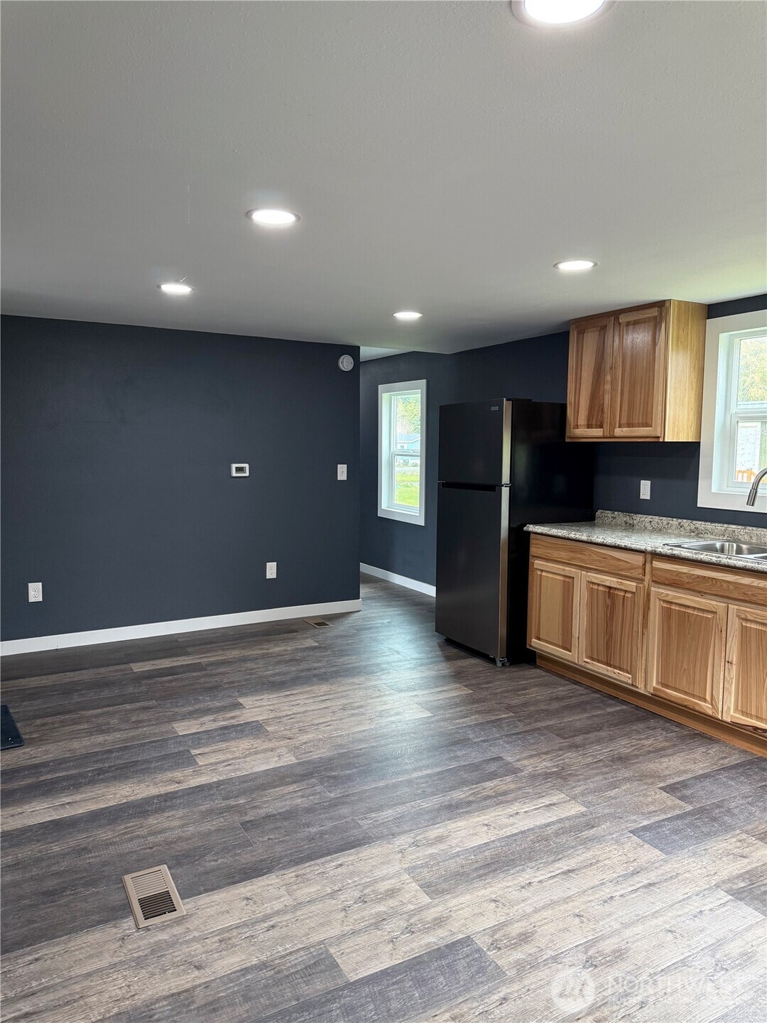 2610 Calawah Way, Unit 47 Forks, WA 98331 - Photo 16 of 17 a kitchen with stainless steel appliances a refrigerator and a stove top oven