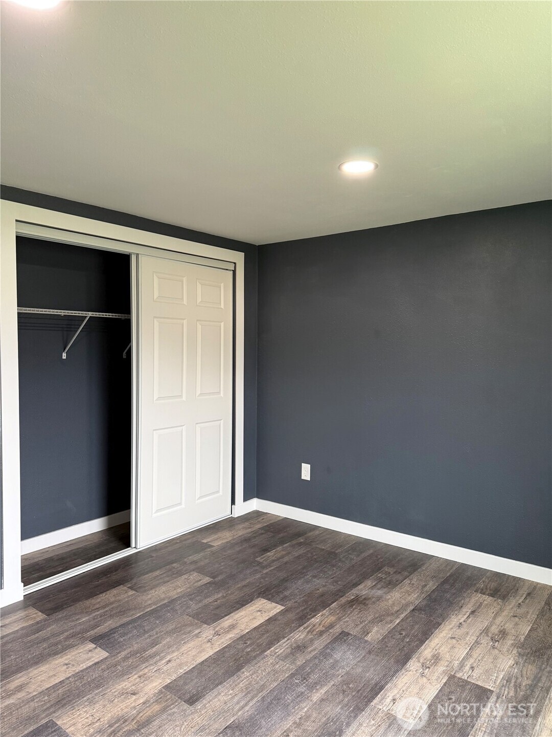 2610 Calawah Way, Unit 47 Forks, WA 98331 - Photo 4 of 17 a view of an empty room with wooden floor and closet