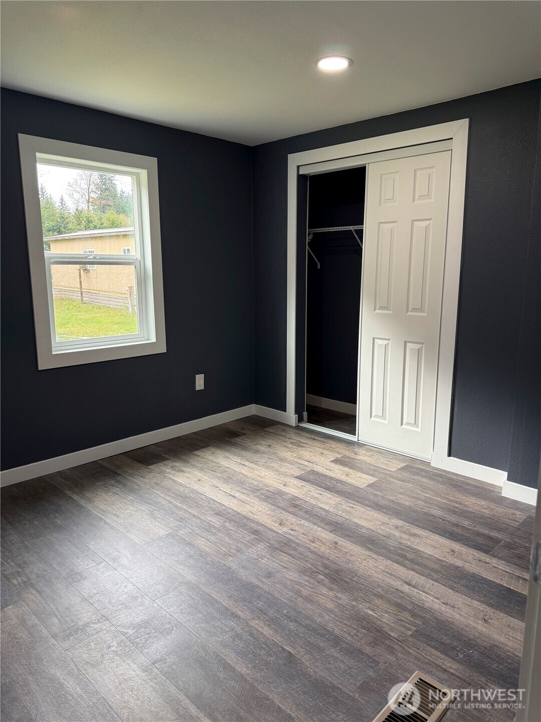 2610 Calawah Way, Unit 47 Forks, WA 98331 - Photo 10 of 17 a view of an empty room with a window