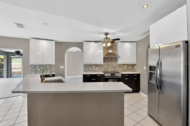 a kitchen with a refrigerator and a sink