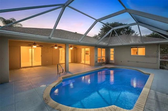 a view of a swimming pool with a lounge chair