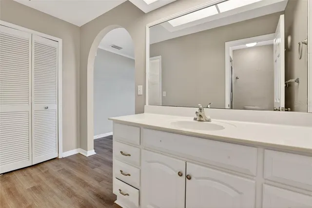 a bathroom with a double vanity sink and mirror