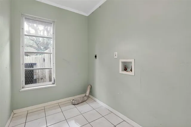 a view of an empty room with a window