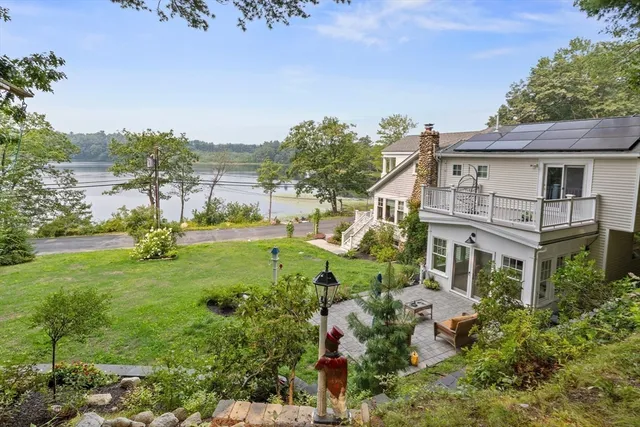 a aerial view of a house with a yard