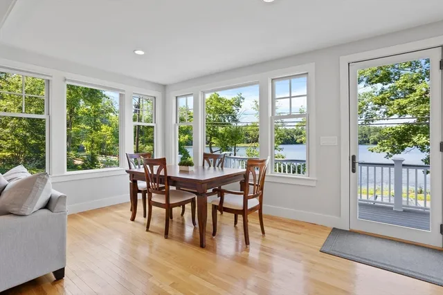 a dining room with furniture window and outside view
