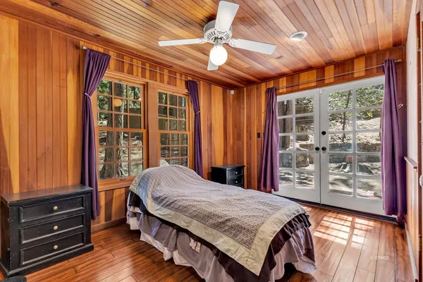 a room with wooden floor and door