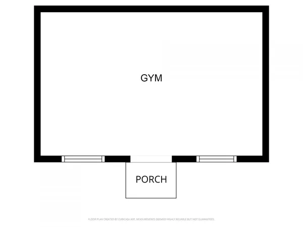 a picture of a bench in front of a wall