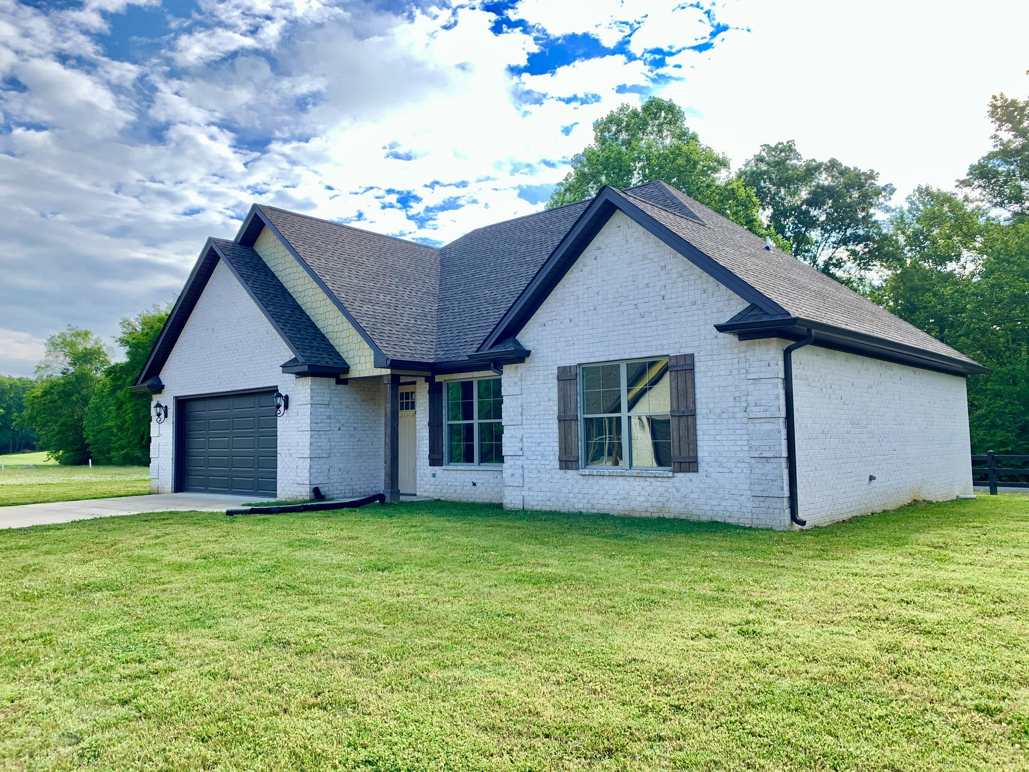 a house with garden in front of it