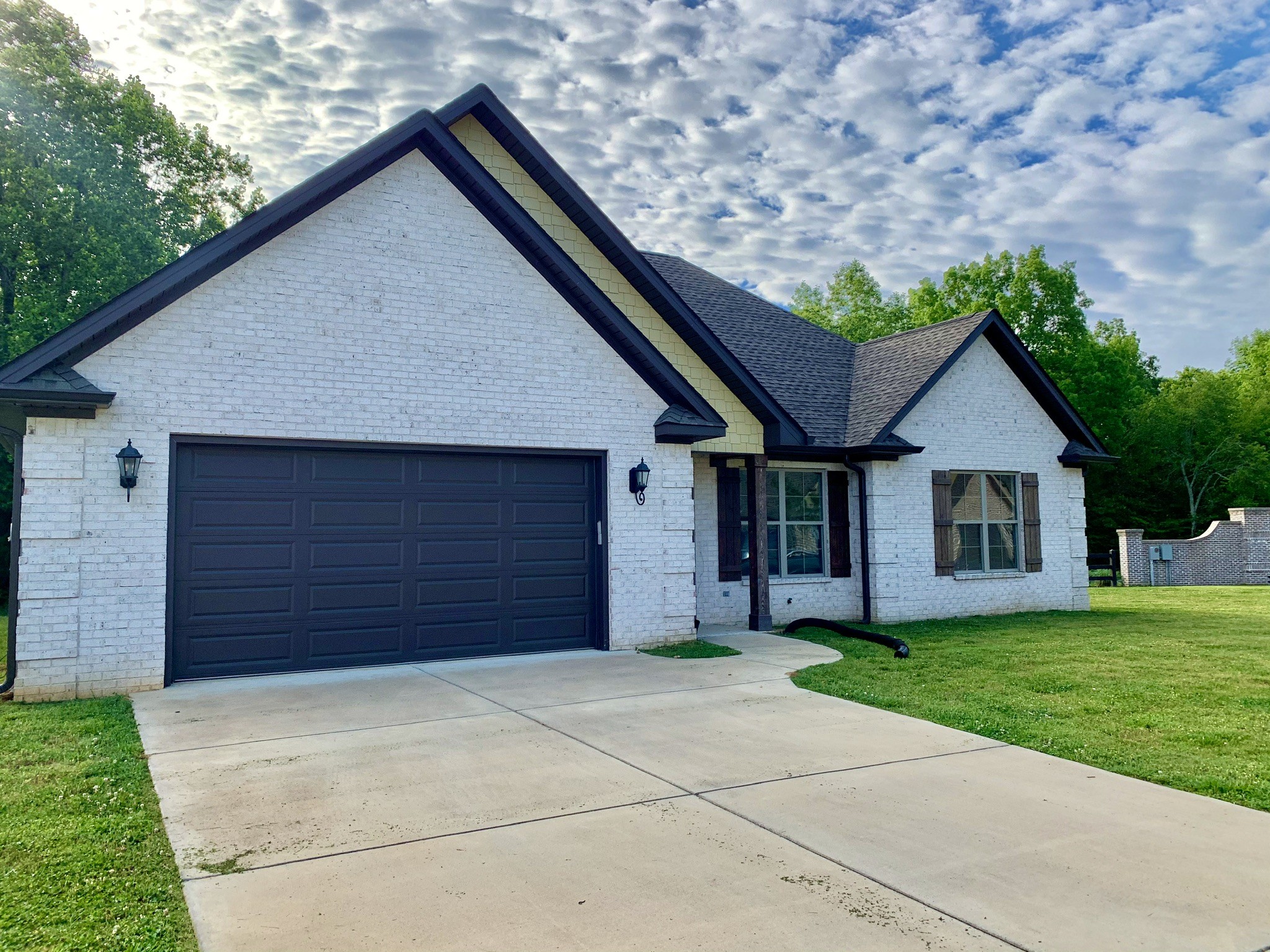 102 Andrews Drive Loretto, TN 38469 - Photo 2 of 11 a front view of a house with a yard