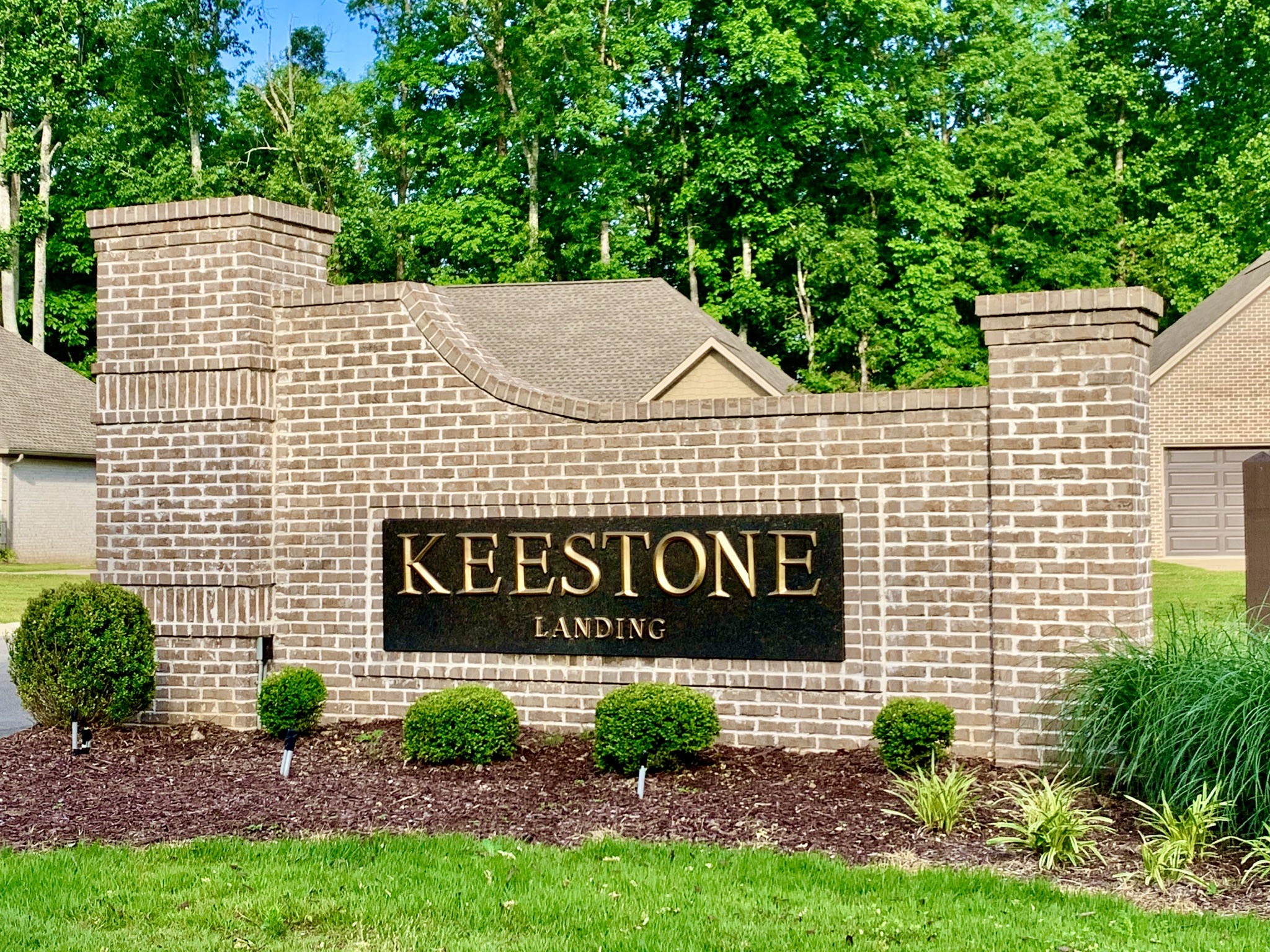 102 Andrews Drive Loretto, TN 38469 - Photo 4 of 11 a sign that is sitting on a brick wall