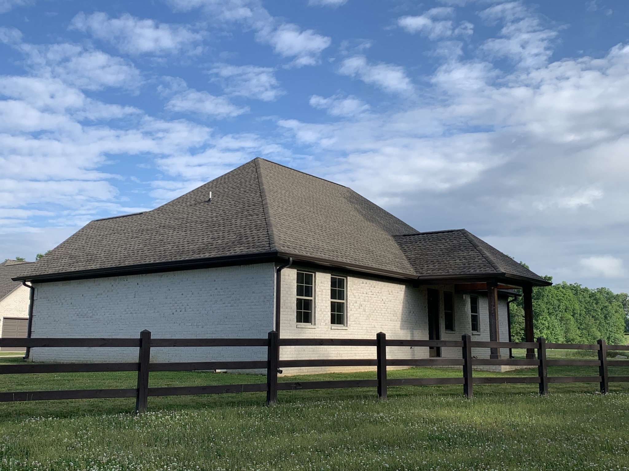 102 Andrews Drive Loretto, TN 38469 - Photo 5 of 11 a front view of a house with a garden