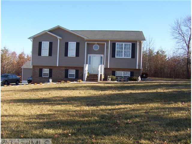 1020 Laurel Crest Road King, NC 27021 - Photo 1 of 9 Exterior Front. front of home with a nice level yard.