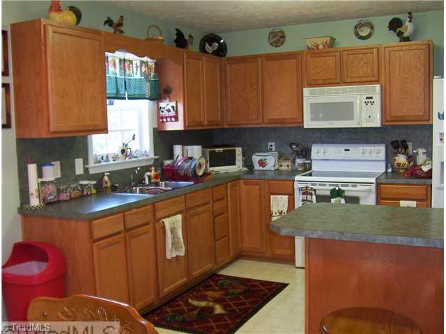1020 Laurel Crest Road King, NC 27021 - Photo 3 of 9 Kitchen. kiitchen with lots of cabinets, eating dining combo.