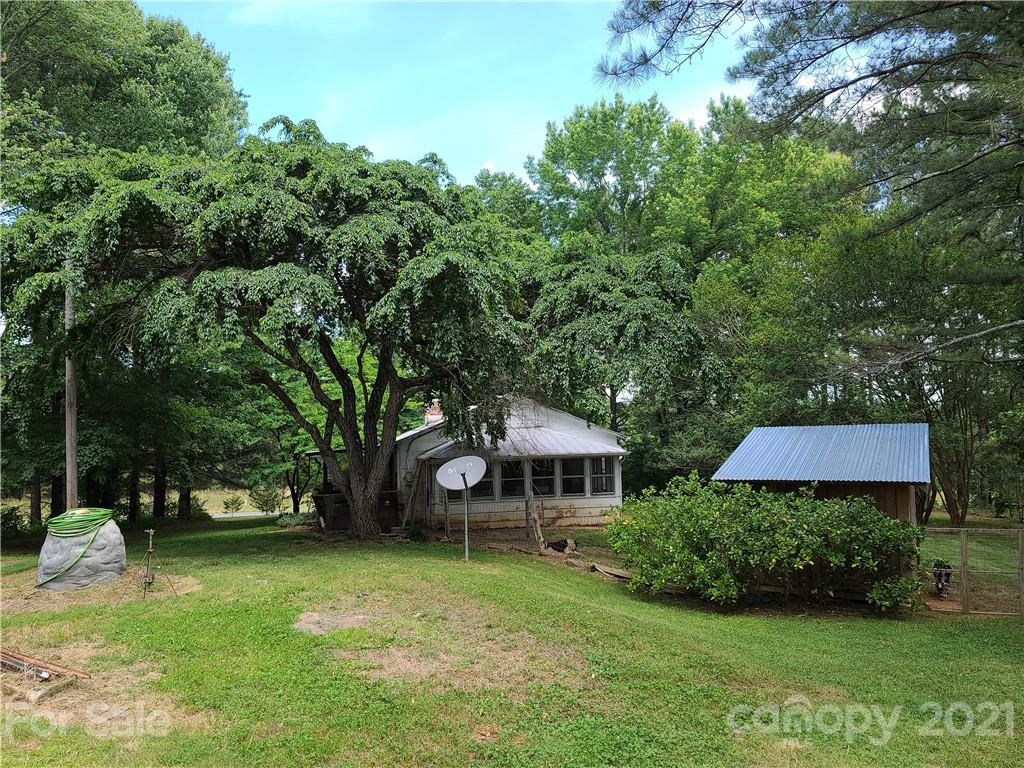 2680 Polk County Line Road Rutherfordton, NC 28139 - Photo 11 of 38 a front view of a house with garden