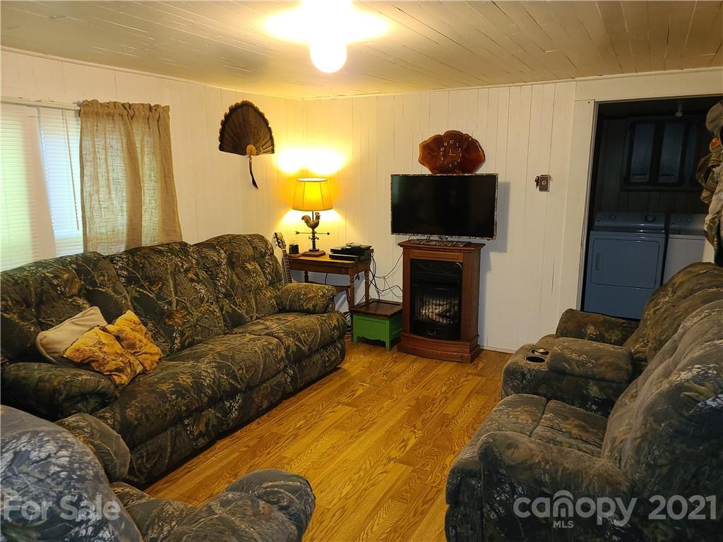 2680 Polk County Line Road Rutherfordton, NC 28139 - Photo 14 of 38 a living room with furniture and a fireplace