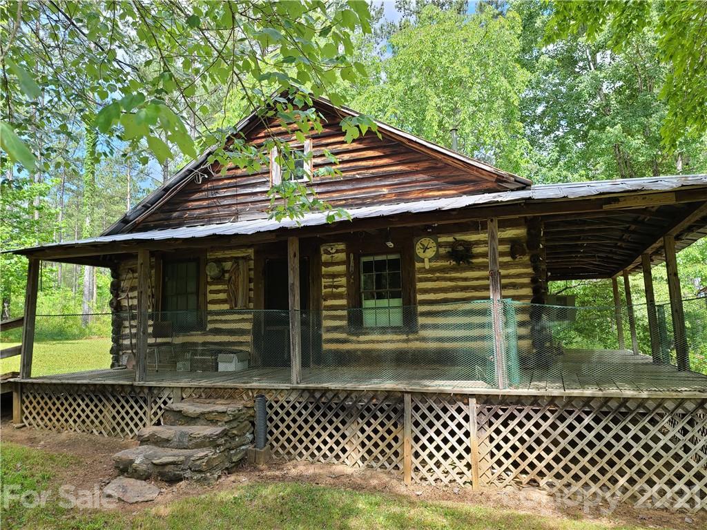 2680 Polk County Line Road Rutherfordton, NC 28139 - Photo 23 of 38 a front view of a house with a garden