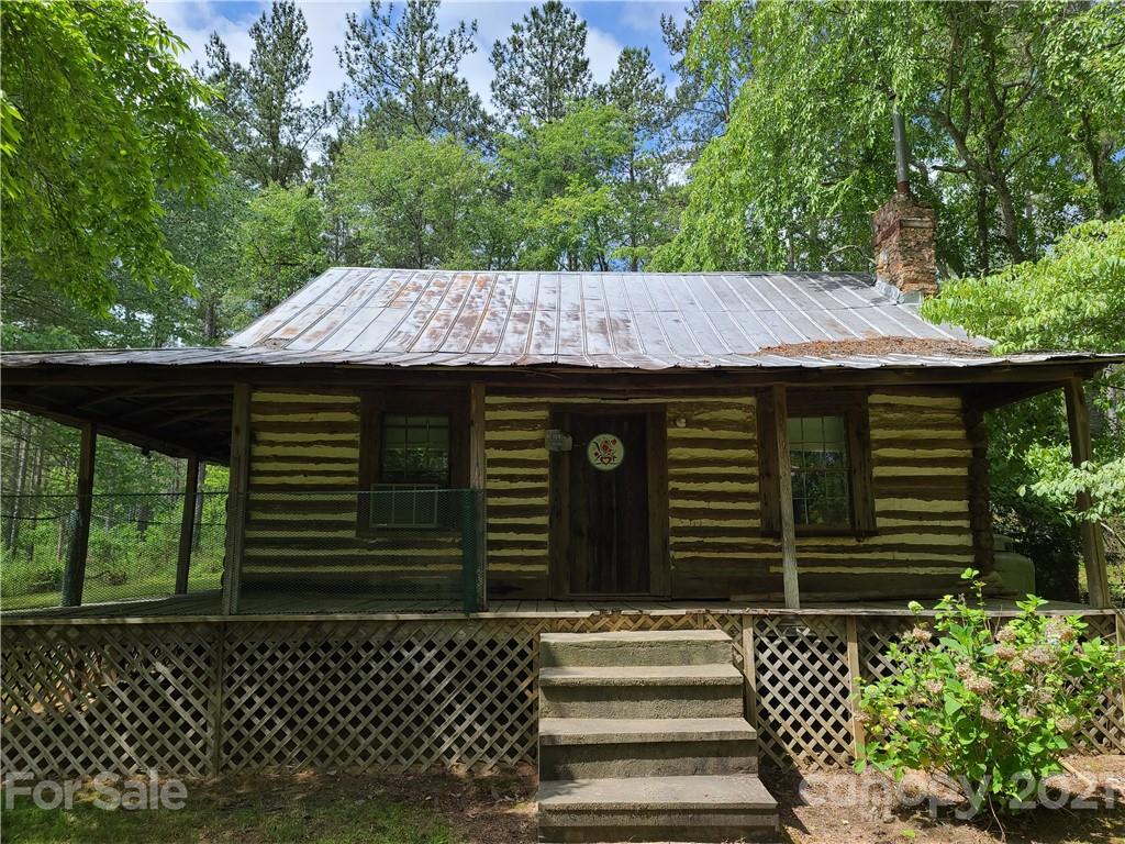 2680 Polk County Line Road Rutherfordton, NC 28139 - Photo 25 of 38 a side view of a house with a garden