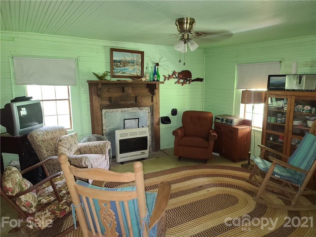 2680 Polk County Line Road Rutherfordton, NC 28139 - Photo 27 of 38 a living room with furniture and a fireplace